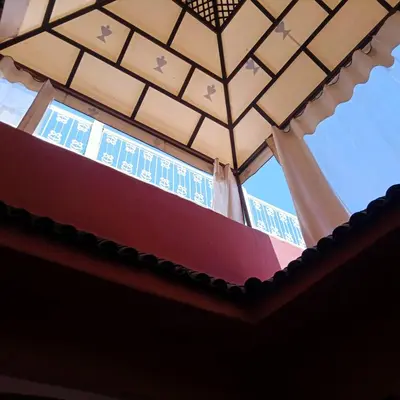 a room with a ceiling with a window at Riad Tifor in Marrakech