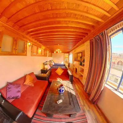 a living room with a couch and a table at Riad Dar Moulay Ali in Marrakech