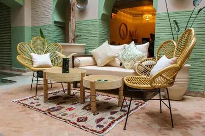 a living room with a couch and chairs at Riad Amra in Marrakech