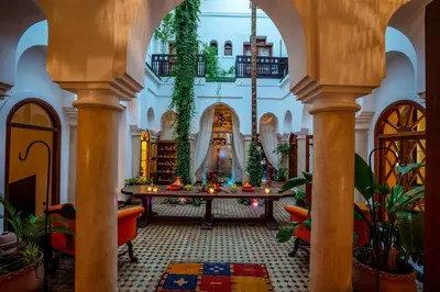 a large room with a table with plants at Riad Ayadina & SPA in Marrakech
