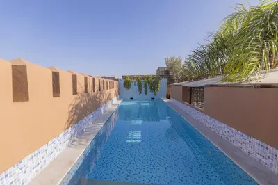 a swimming pool on the side of a building at Riad Ayadina & SPA in Marrakech