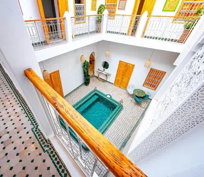 an overhead view of a swimming pool in a house at Riad La Croix Berbere in Marrakech