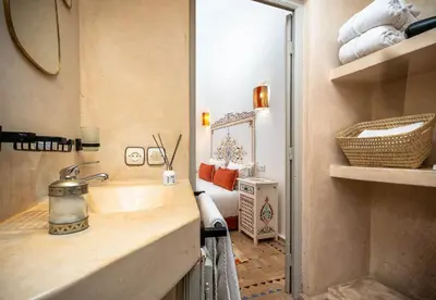 a bathroom with a sink and a mirror at Riad La Croix Berbere in Marrakech