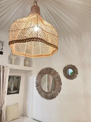 a chandelier and two mirrors in a room at Riad Les Orangers D'alilia in Marrakech