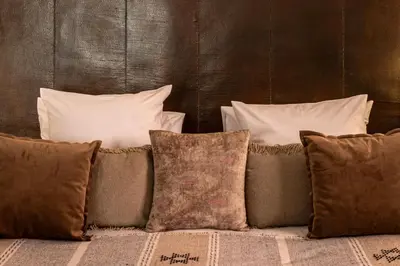 a group of pillows sitting on top of a couch at Riad O in Marrakech