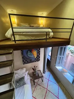 a small room with a bunk bed and a window at Riad Vendôme & Spa in Marrakech