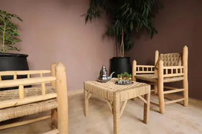 a room with two chairs and a table and a table and chairs at Riad Sidi Mimoune & Spa in Marrakech