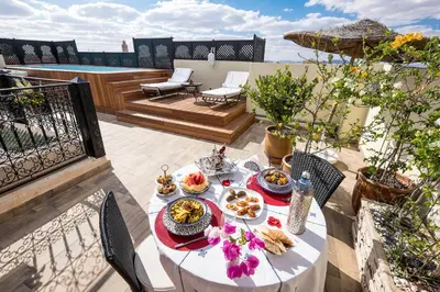 a table with food on top of a balcony at Riad Nesma Suites & Spa in Marrakech