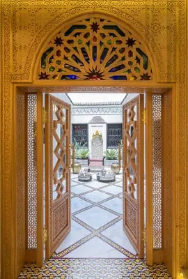 an entrance to a building with an open door at Riad Nesma Suites & Spa in Marrakech