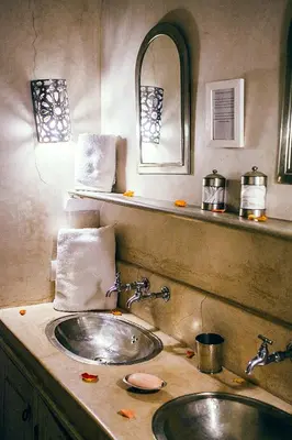a bathroom with a sink and a mirror at Riad Le Rihani in Marrakech