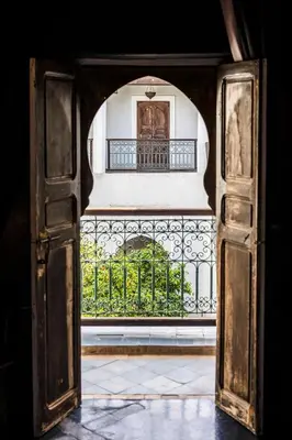 an open door to a balcony with a gate at Riad Le Rihani in Marrakech