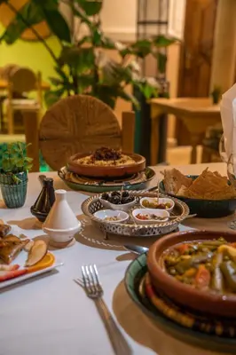 a table with many plates of food on it at Monriad in Marrakech
