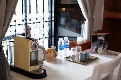 a sewing machine sitting on a counter next to a window at Riad Ajmal in Marrakech