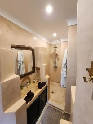 a bathroom with a sink and a mirror at Riad Alboraq in Marrakech