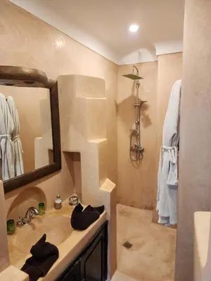a bathroom with a sink and a shower at Riad Alboraq in Marrakech