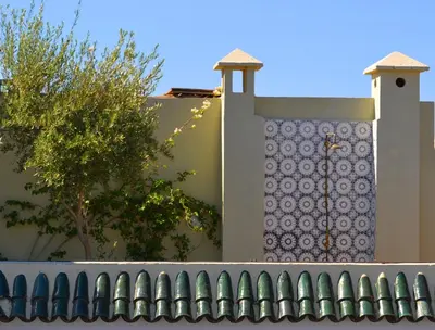a fence in front of a house with a window at Riad Kasbah & Spa in Marrakech