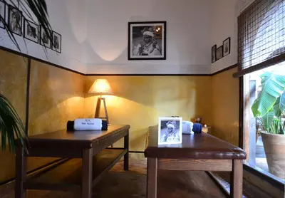 a room with two wooden tables and a lamp at Riad Kasbah & Spa in Marrakech