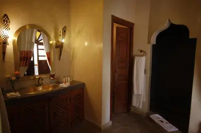 a bathroom with a sink and a mirror at Riad Léna & Spa in Marrakech