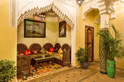 a living room with a couch in a room at Riad Sofia in Marrakech