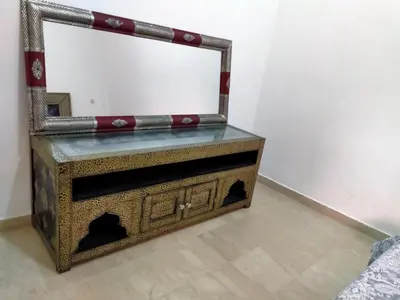 a mirror sitting on top of a table at Ritaj Apartement in Marrakech