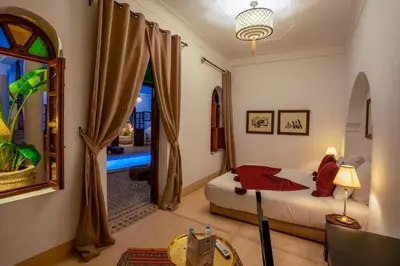 a bedroom with a bed and a window at Riad Adika & Spa in Marrakech