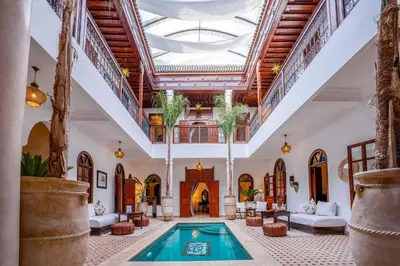 a large room with a swimming pool in a building at Riad Adika & Spa in Marrakech