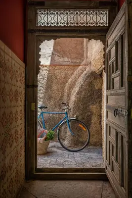 a bike parked in the doorway of a building at Riad Kbour & Chou in Marrakech