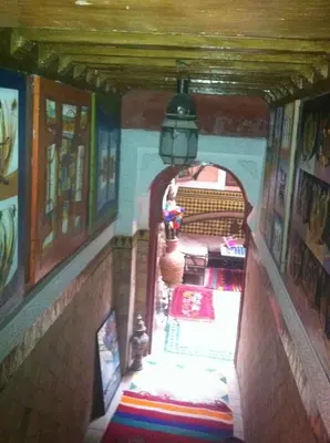 a hallway of a house with an archway in a room at Riad Tarik in Marrakech