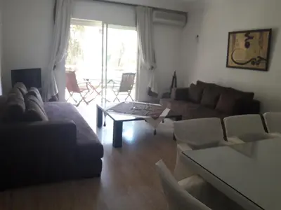 a living room with a couch and a table at Luxury appartement 105m2-hivernage-Sofitel in Marrakech