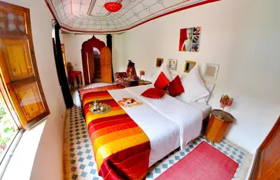 a bedroom with two beds in a room at Riad Hidden in Marrakech