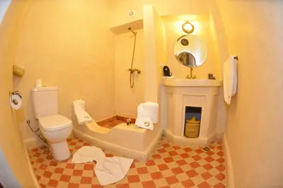 a bathroom with a toilet and a sink at Riad Hidden in Marrakech