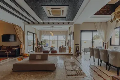 a living room with a couch and a table at Villa Nelya in Marrakech