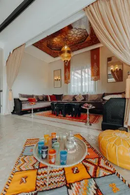 a living room with a couch and a table at Villa Nelya in Marrakech