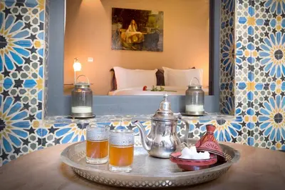 a tray with drinks on a table in a hotel room at Riad Adrar in Marrakech