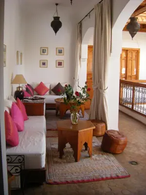 a living room with a couch and a table at Riad Irene in Marrakech