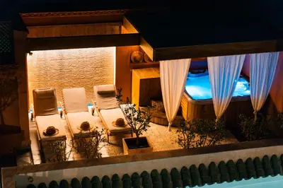 a view of a balcony with chairs and a window at Ysalis Riad Restaurant & Spa in Marrakech