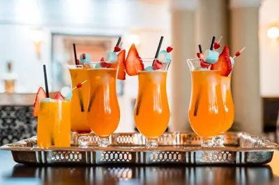 a group of four drinks on a tray with fruit at Ysalis Riad Restaurant & Spa in Marrakech