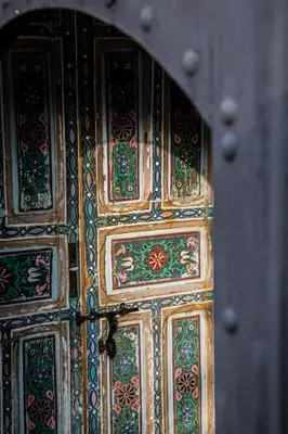 a close up of a wooden door with intricate designs at Riad Danka in Marrakech