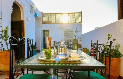 a table with a tea pot on top of it at Dar Habache in Marrakech