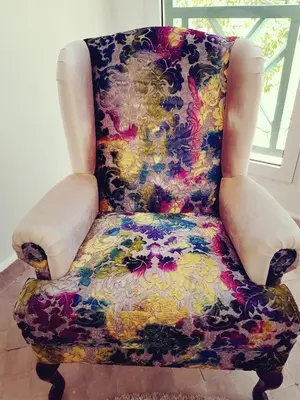 a chair with a flowered seat in a room at Oxygène in Marrakech