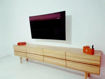 a flat screen tv on top of a wooden dresser at Oxygène in Marrakech