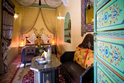 a living room with a couch and a table at Riad bleu du Sud in Marrakech