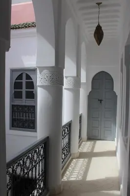 a hallway of a house with a door at Riad El Arco ROOFTOP POOL & Spa in Marrakech