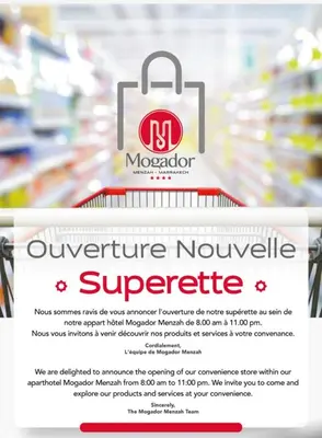 a supermarket sign with a shopping bag on a supermarket shelf at Mogador Menzah Appart Hôtel in Marrakech
