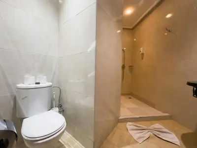 a bathroom with a toilet and a shower at Mogador Menzah Appart Hôtel in Marrakech