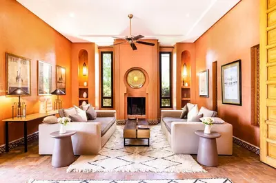 a living room with two couches and a fireplace at Villa de Luxe avec Piscine Privée et Golf in Marrakech