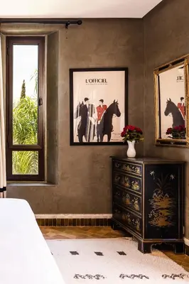 a bedroom with a dresser and a picture of a horse at Villa de Luxe avec Piscine Privée et Golf in Marrakech