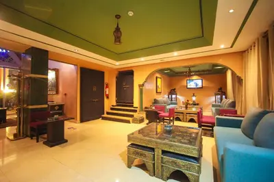 a living room with a couch and a table at Hotel El Hadna By HMS in Marrakech