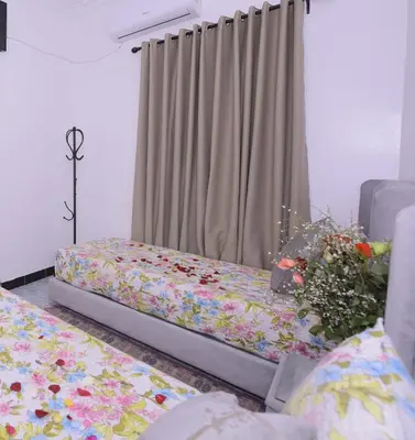 a bedroom with a bed with flowers on it at Hotel Riad Fantasia in Marrakech