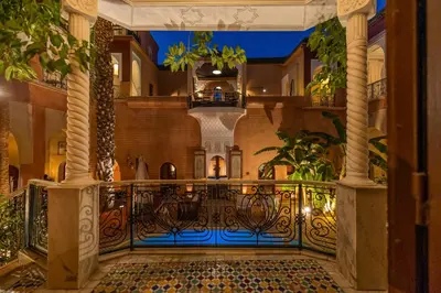 a hallway with a gate in a building at Indian Palace in Marrakech